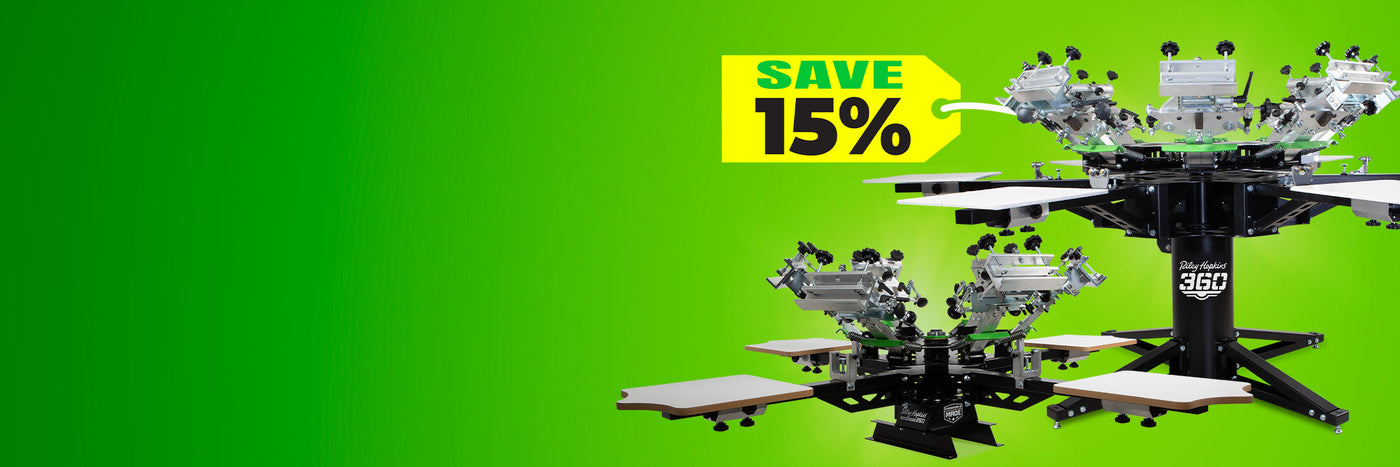 Black Friday sale banner featuring bold text reading "Black and Green Friday" against a bright green background. The text "Save 15%" is highlighted in a yellow box in the bottom right corner. Surrounding the text are components of a Riley Hopkins 360 screen printing press, showcasing the machine's build and functionality. The design conveys a sense of urgency and excitement for a holiday sale on screen printing equipment.